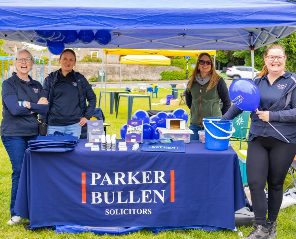 Four people at the Parker Bullen stall at the festival